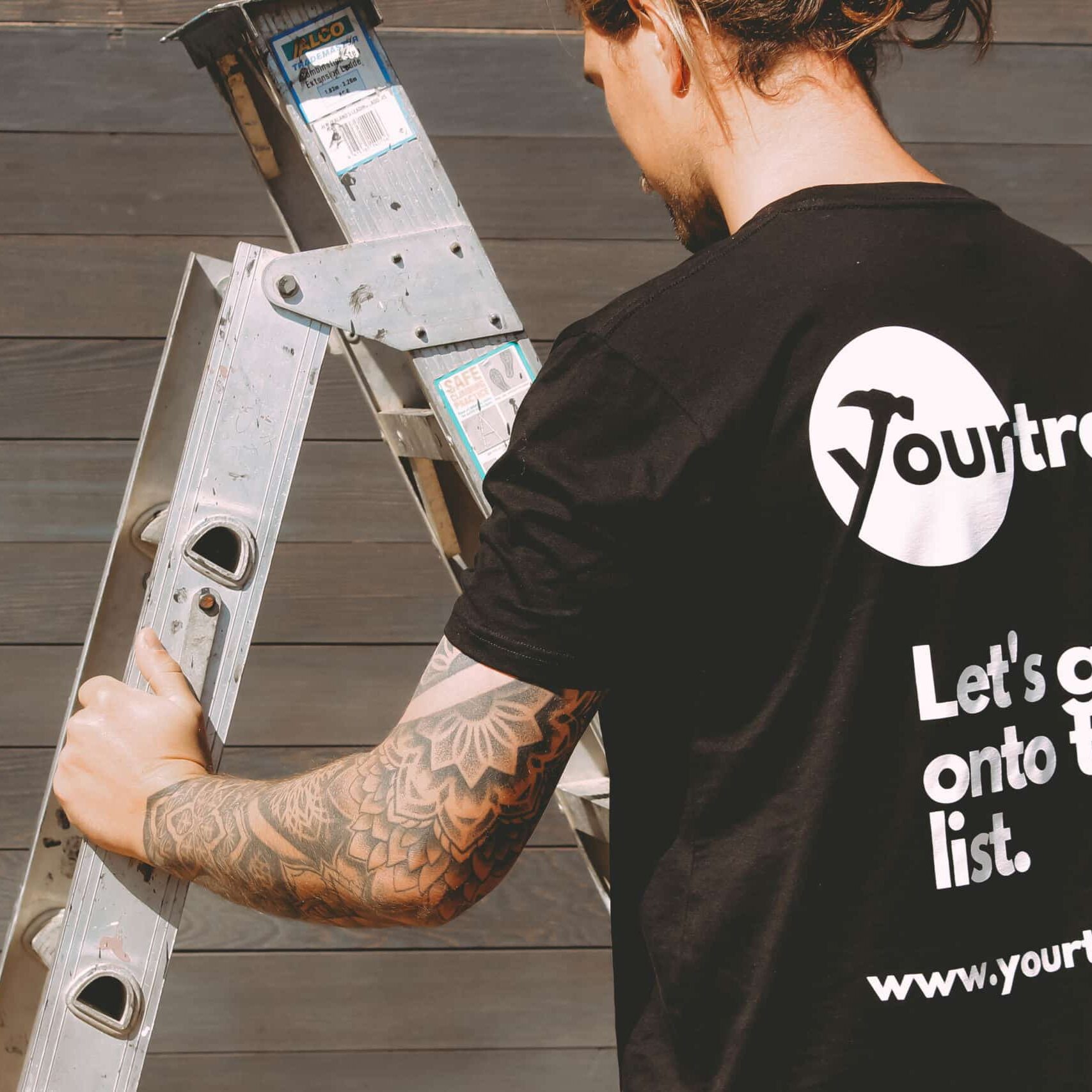 Auckland home renovation - Yourtradie worker using a ladder